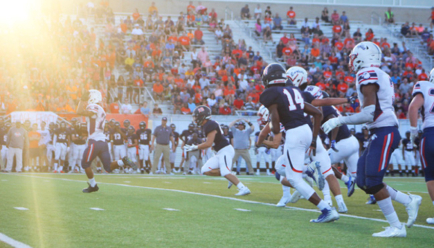 Olathe North football players face off with Olathe East players at the Olathe North vs. East on August 31st.