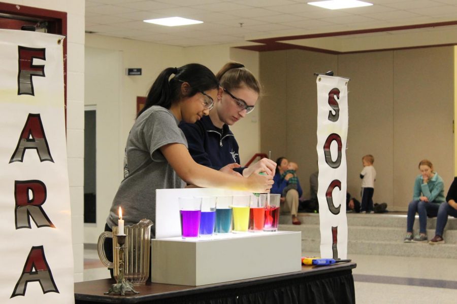 Seniors Emily Martin and Jolly Patro demonstrate a color change in a demonstration called “margaritaville”. “Margaritaville is my favorite demo, I was ecstatic to perform it today,” Martin said.
