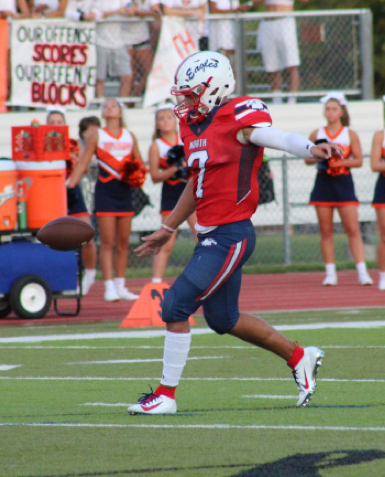  Junior Arland Bruce IV kicks off against Olathe East. The Eagles beat the Hawks 27-21 winning their first home game at ODAC. “I love playing at ODAC because it’s cool to see the whole community come out to the game,” Arland said.