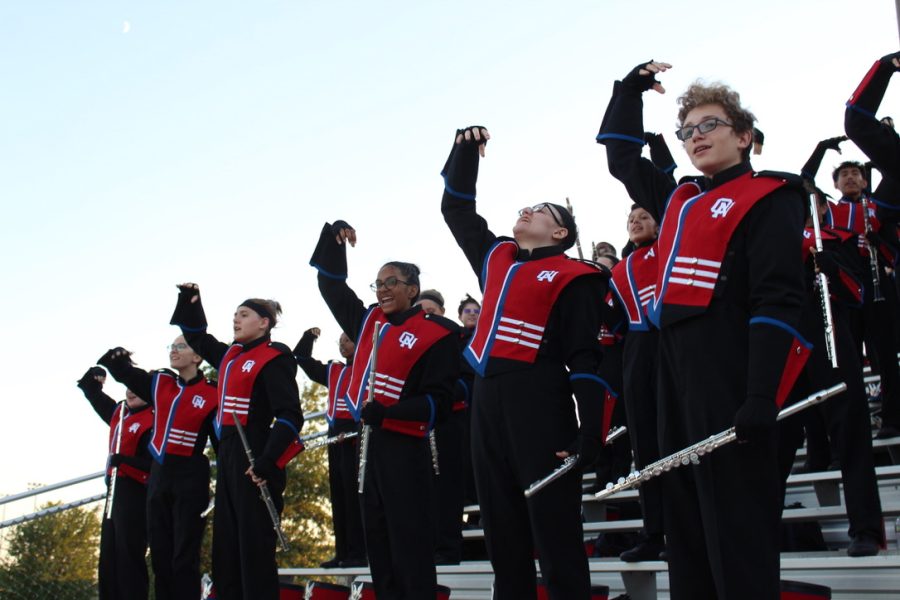 The Olathe North Screamin Eagle marching band in the stands during the Olathe North Varsity football game. This was a great first marching season for me, freshman Azazel Dawson said. | Photo by Paige Keith