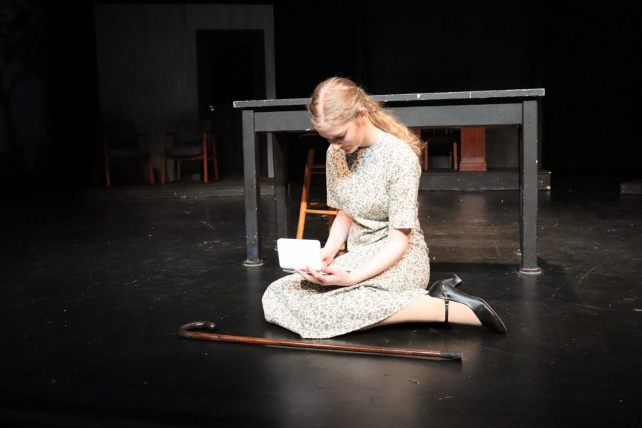 Junior Mikayla Pelletier, as Grace Fryer, painting by her friend Kathryn's grave.