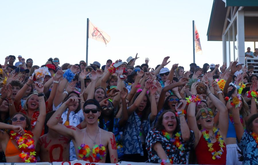 The Olathe North student section, led by Eagle Flight Crew, participating in the beach-out theme at the September 2 game against Olathe East. | Photo by Jessica McCue