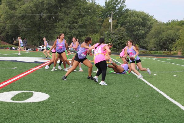 Juniors Mya Underwood and Layla Simmons attempt to break a tackle. 