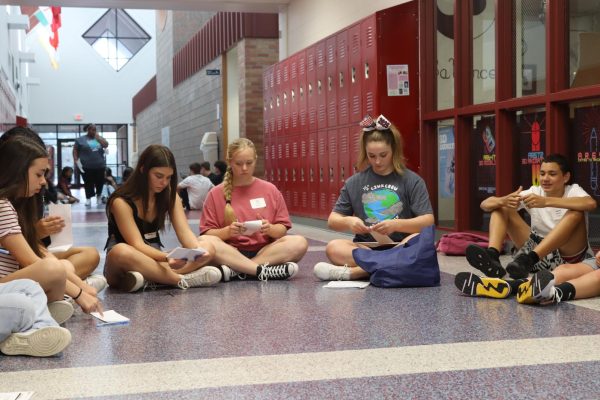 Link Leader Charlotte Leonard (12) leads an activity with freshmen Ava Lewis, Allison Leonardi, Dante Rowden.